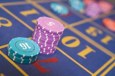 Wide view of live-dealer baccarat studio on seven77 login